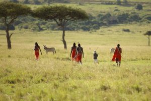 Clients enjoying a Walking Safari Kenya Guide experience in the Laikipia wilderness with a professional safari guide and ranger.