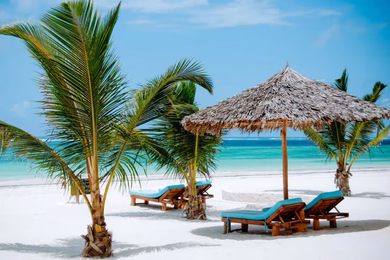 Ultimate Diani Beach Guide, pristine white sands and turquoise waters at Diani Beach on the Kenyan coast.