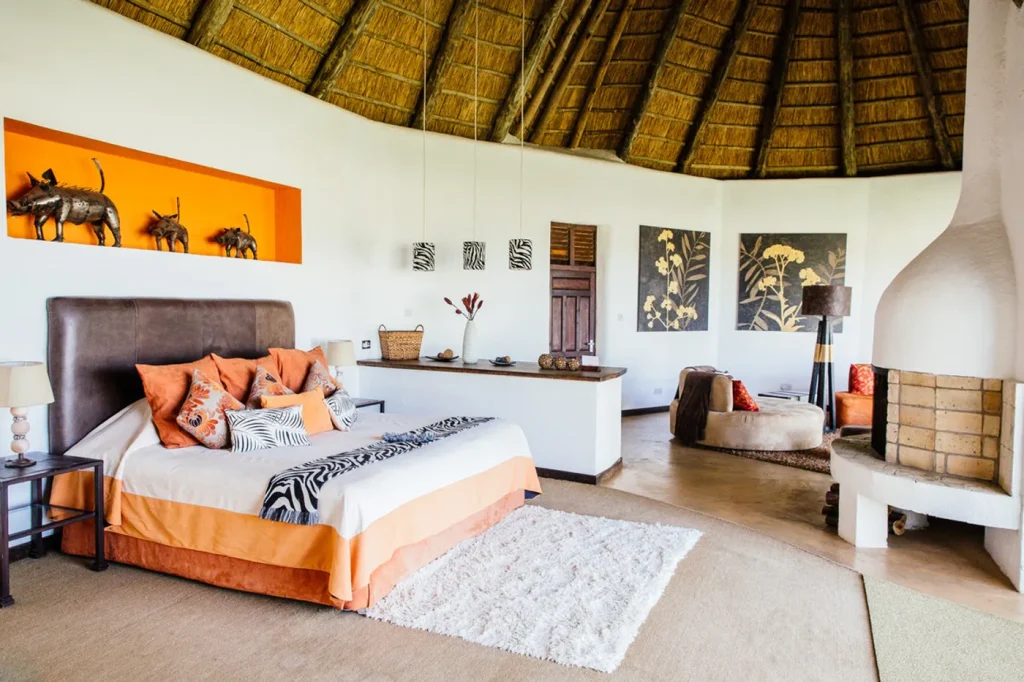 High-end safari accommodation bedroom overlooking wildlife plains in Solio Conservancy