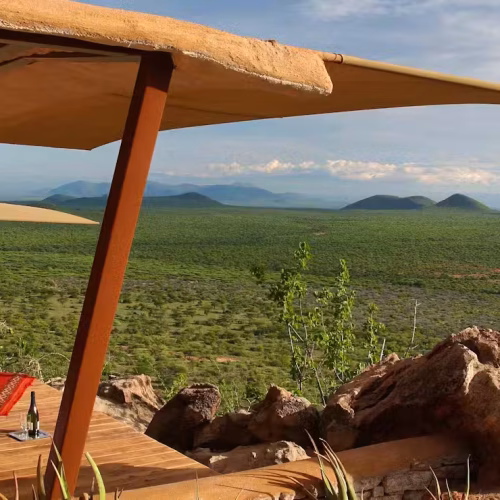 2-Day Masai Mara Safari Package inspired luxury lodge experience in Samburu featuring elegant safari suites overlooking the wilderness.