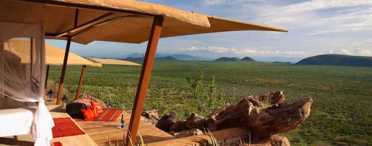 2-Day Masai Mara Safari Package inspired luxury lodge experience in Samburu featuring elegant safari suites overlooking the wilderness.