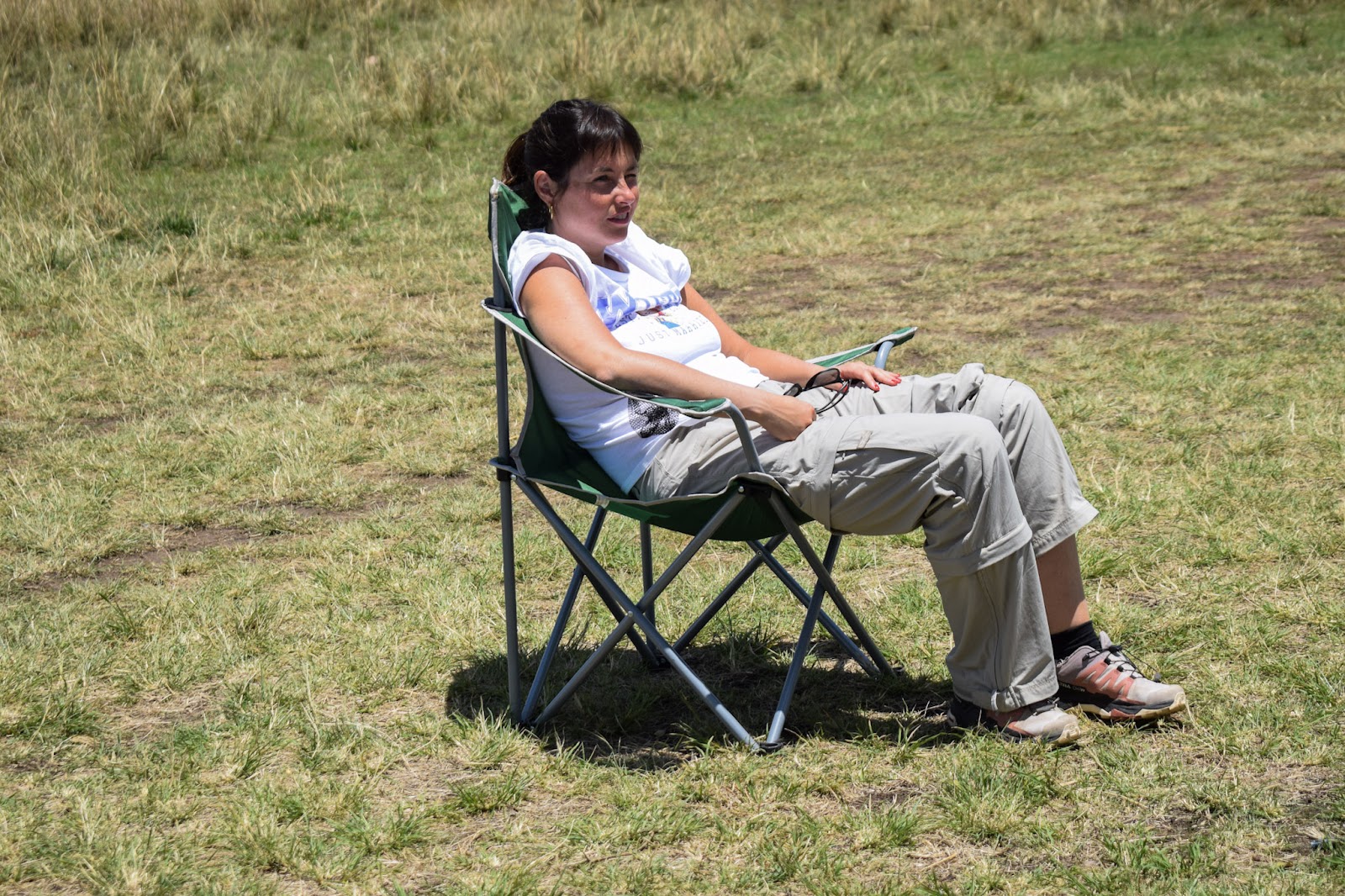 Guest relaxing comfortably at a bush safari camp