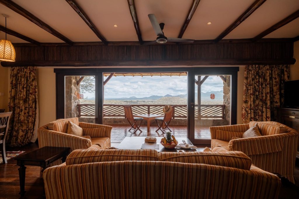 Suite lounge and balcony at Kilaguni Serena Safari Lodge overlooking Tsavo West