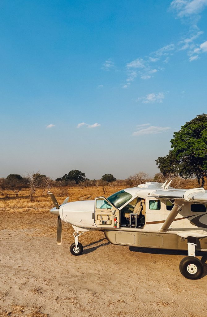 Light aircraft parked on a dry savannah airstrip in Africa