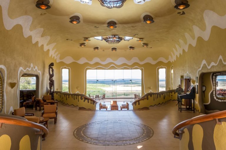 The Maasai-manyatta-inspired lobby of Mara Serena Safari Lodge overlooking the Mara plains