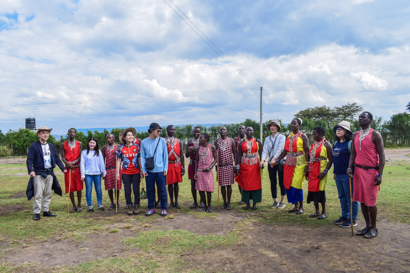 Safari group photo with community members in Kenya