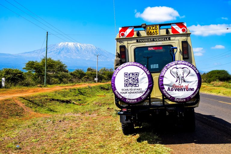 Sense of Adventure safari van on the road to Kilimanjaro