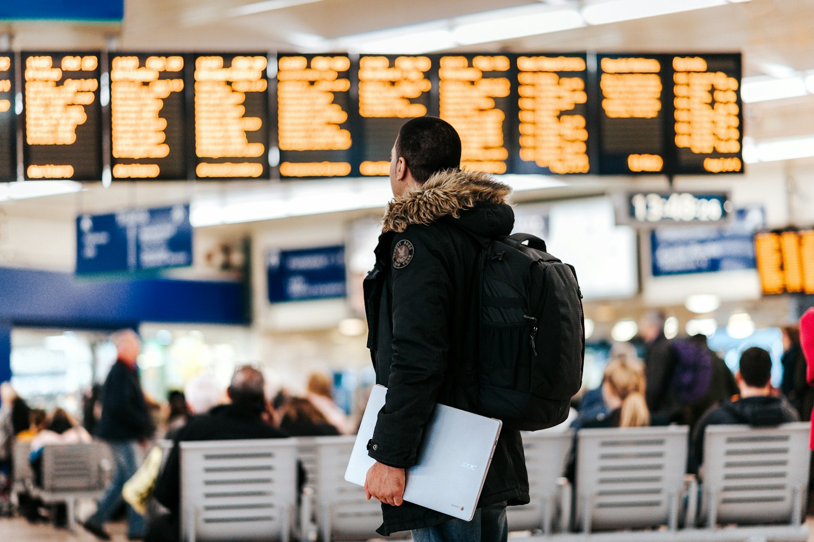 Traveller checking an airport departures board before flying to Nairobi