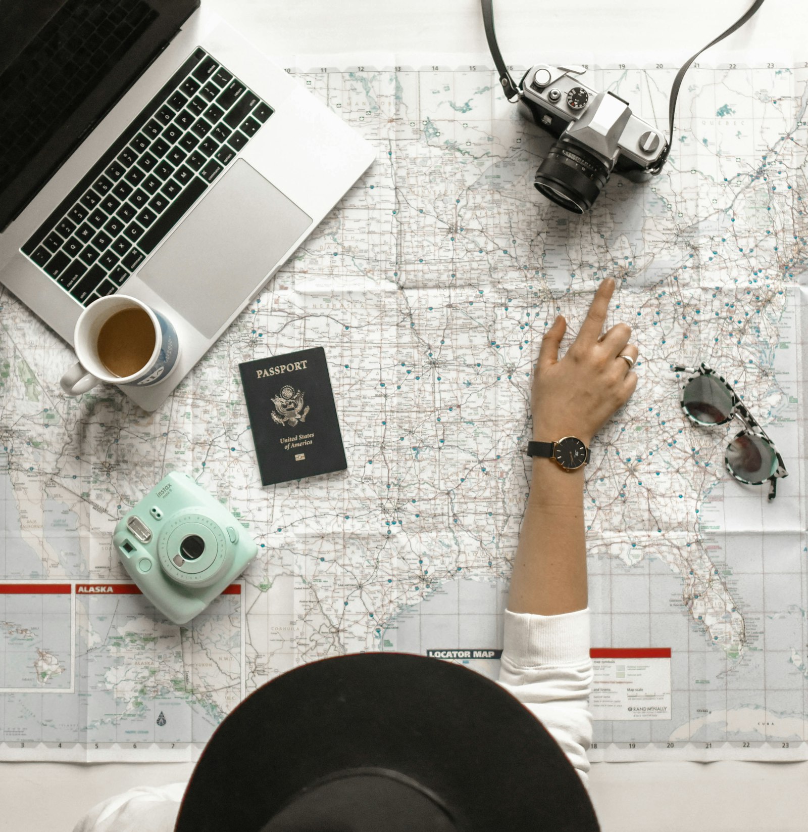 Travel professional pointing at a map while planning a Kenya safari itinerary for clients