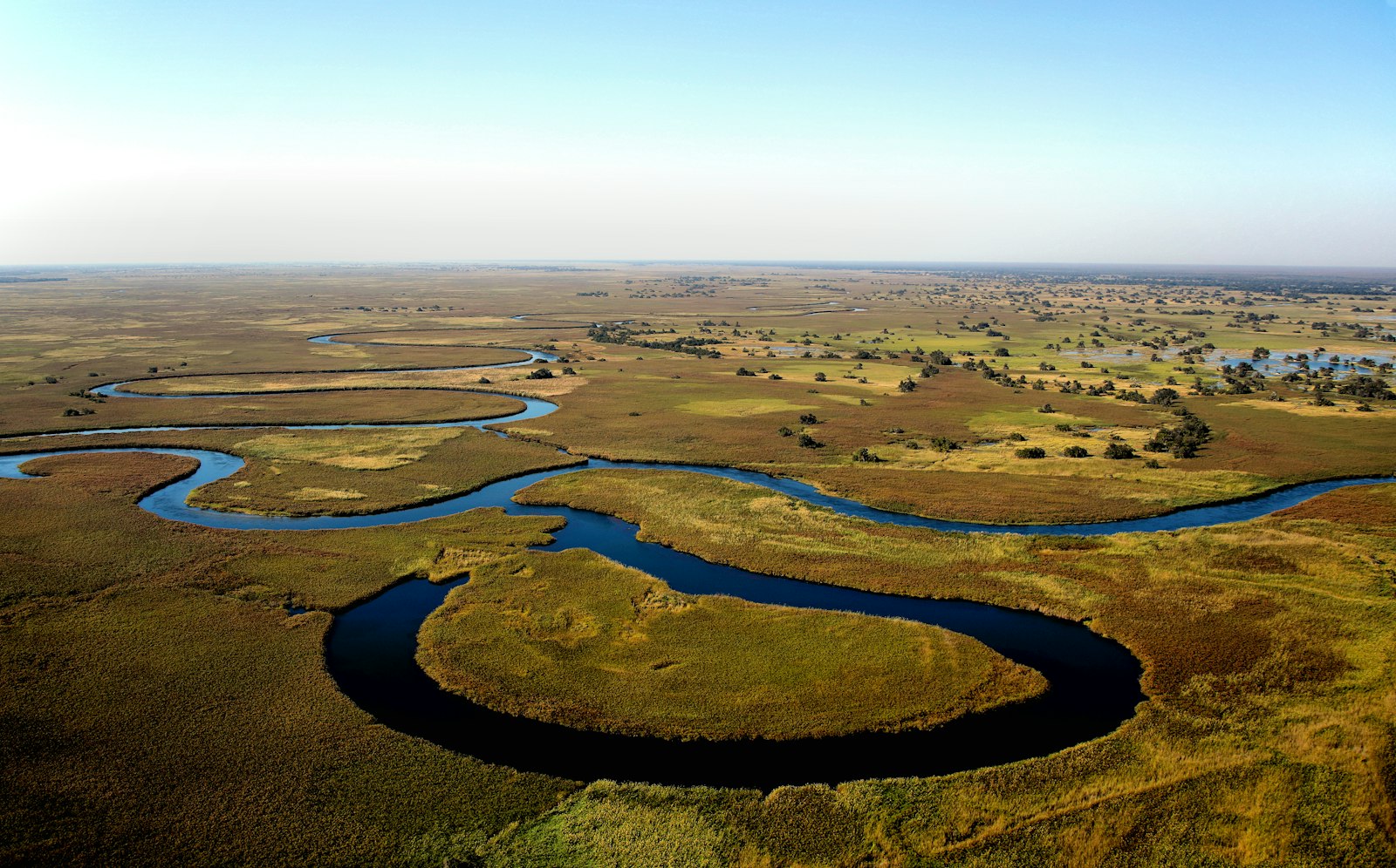 Aerial view of water channels winding through the wetlands of Botswana's Okavango Delta