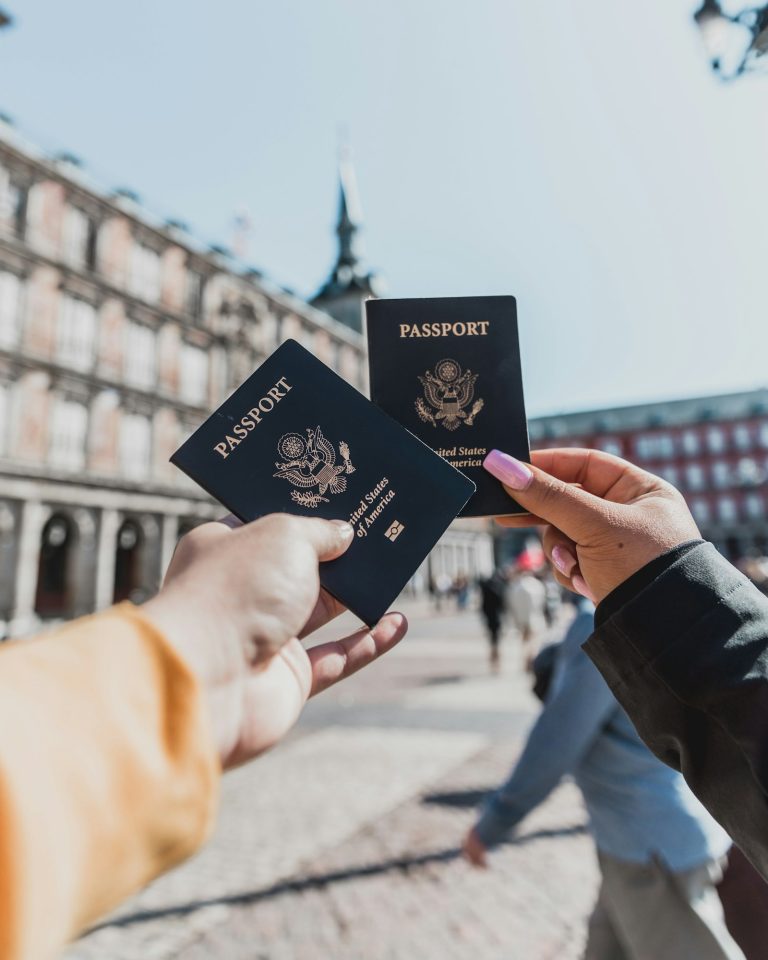 Traveller holding passports, the kind of client documents prepared for a white label safari Kenya booking