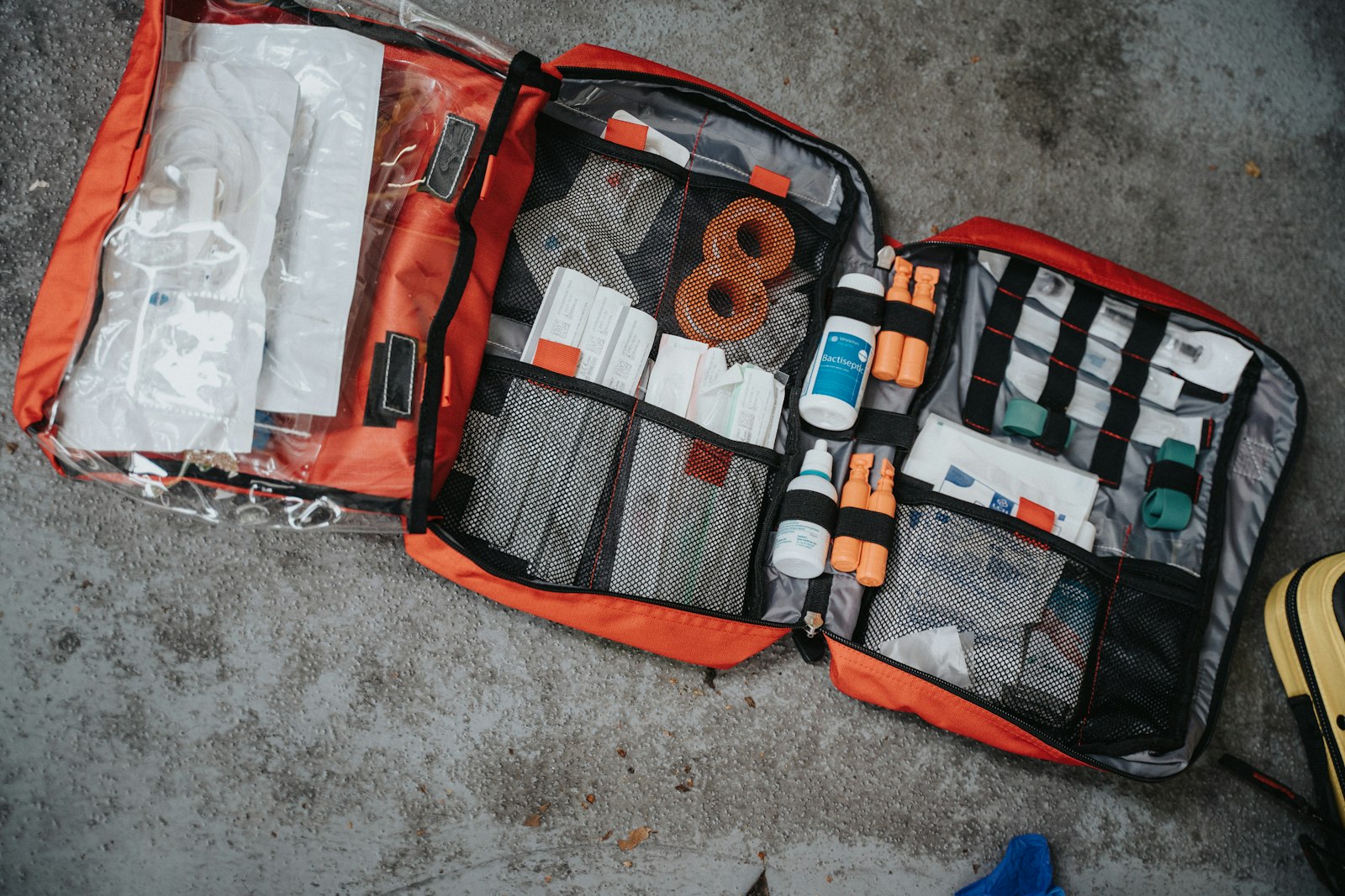 Sick on safari: an open red first aid bag with medical supplies ready for travel