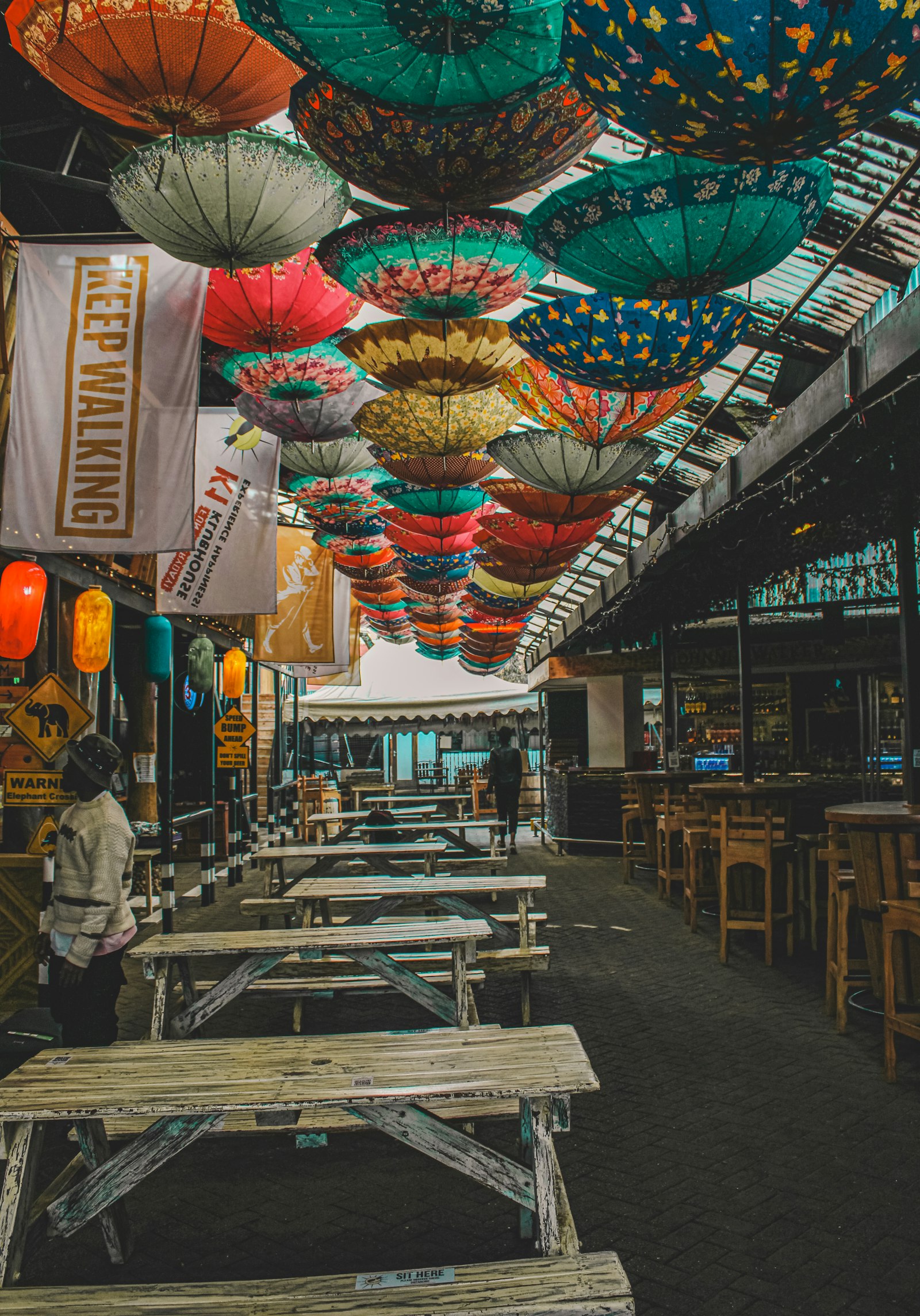 A Nairobi street with outdoor tables and umbrellas, a relaxed place to eat on a stopover