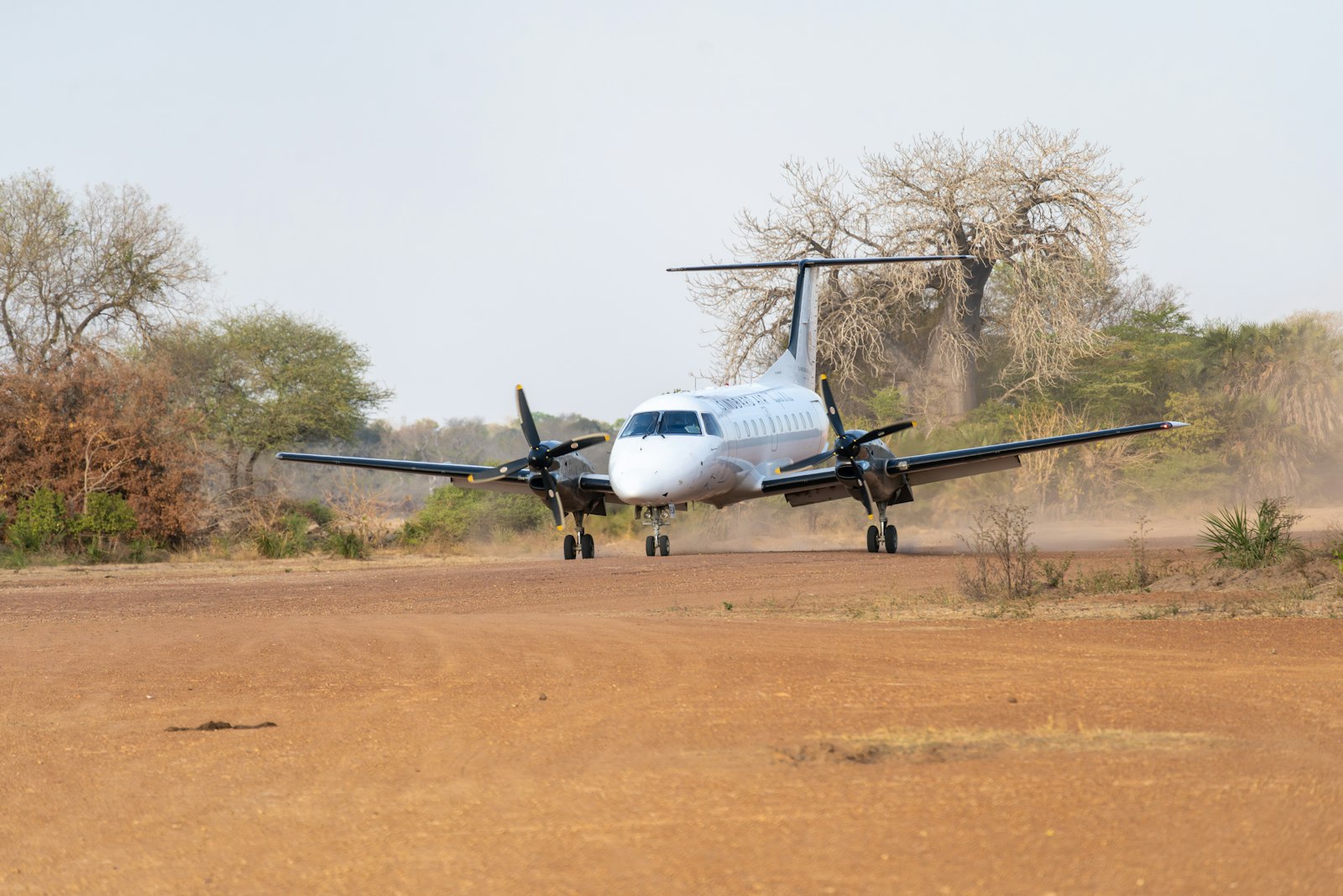 Light safari aircraft landing on a dirt airstrip, the flight you reach from JKIA to Wilson Airport