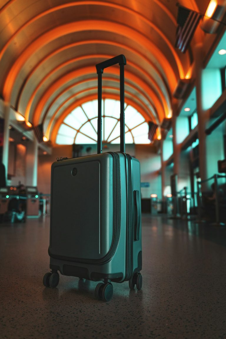 Suitcase standing in an airport terminal, planning Nairobi layover luggage before leaving JKIA