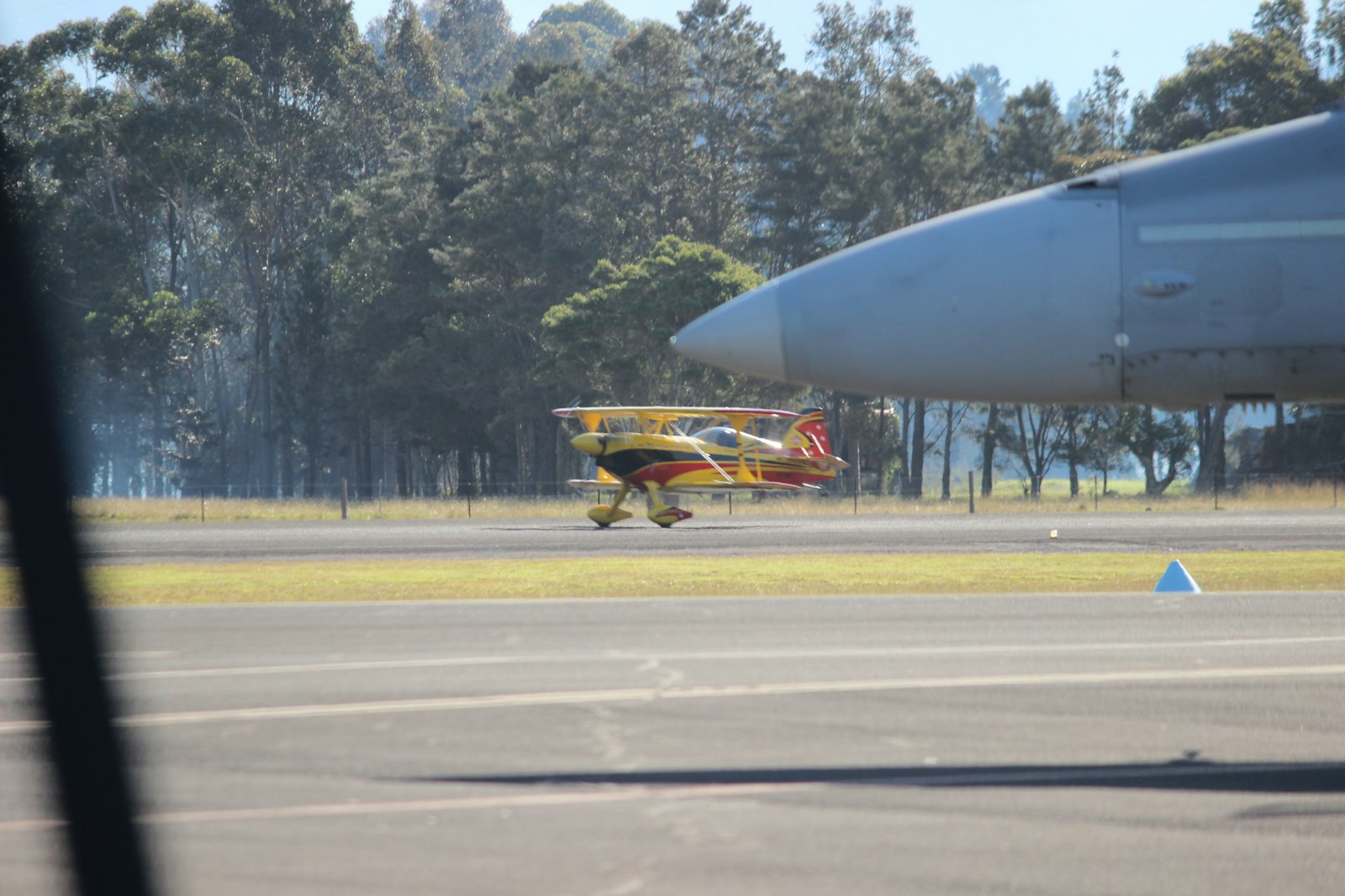 Small propeller plane on a runway with trees behind, like a domestic safari flight