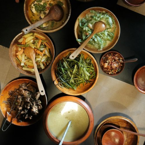 Local dishes served in wooden bowls, a taste of what to eat in Nairobi