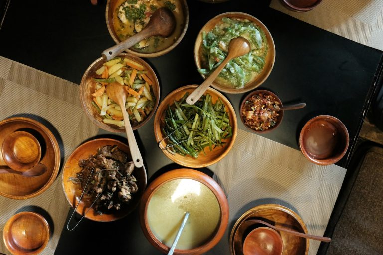 Local dishes served in wooden bowls, a taste of what to eat in Nairobi